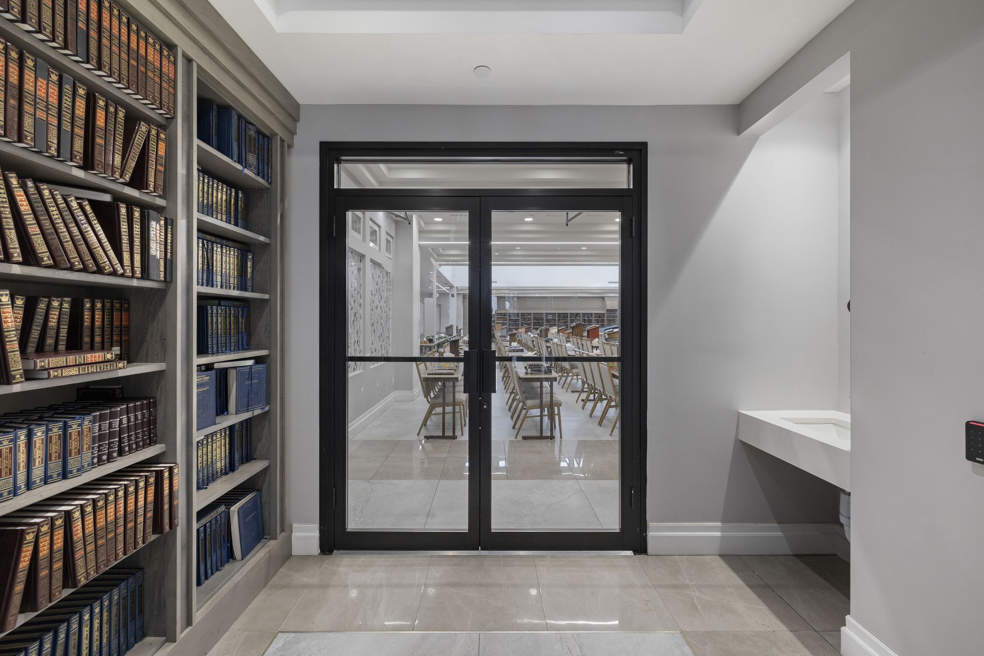 Built-in shelving beside the glazed entrance