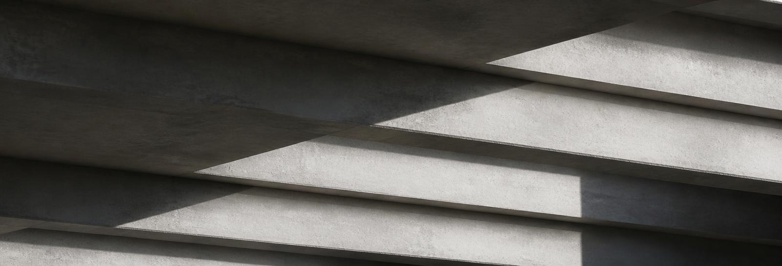 Stepped concrete soffit, layered planes catching light