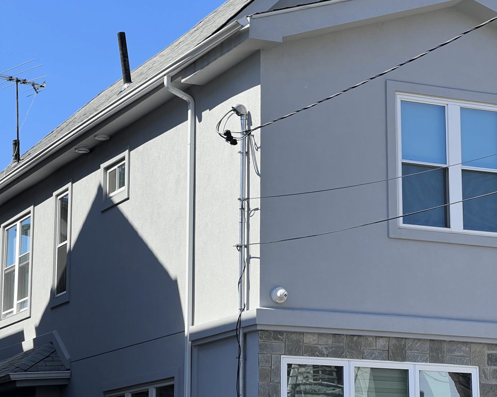 Exterior work in progress between two homes